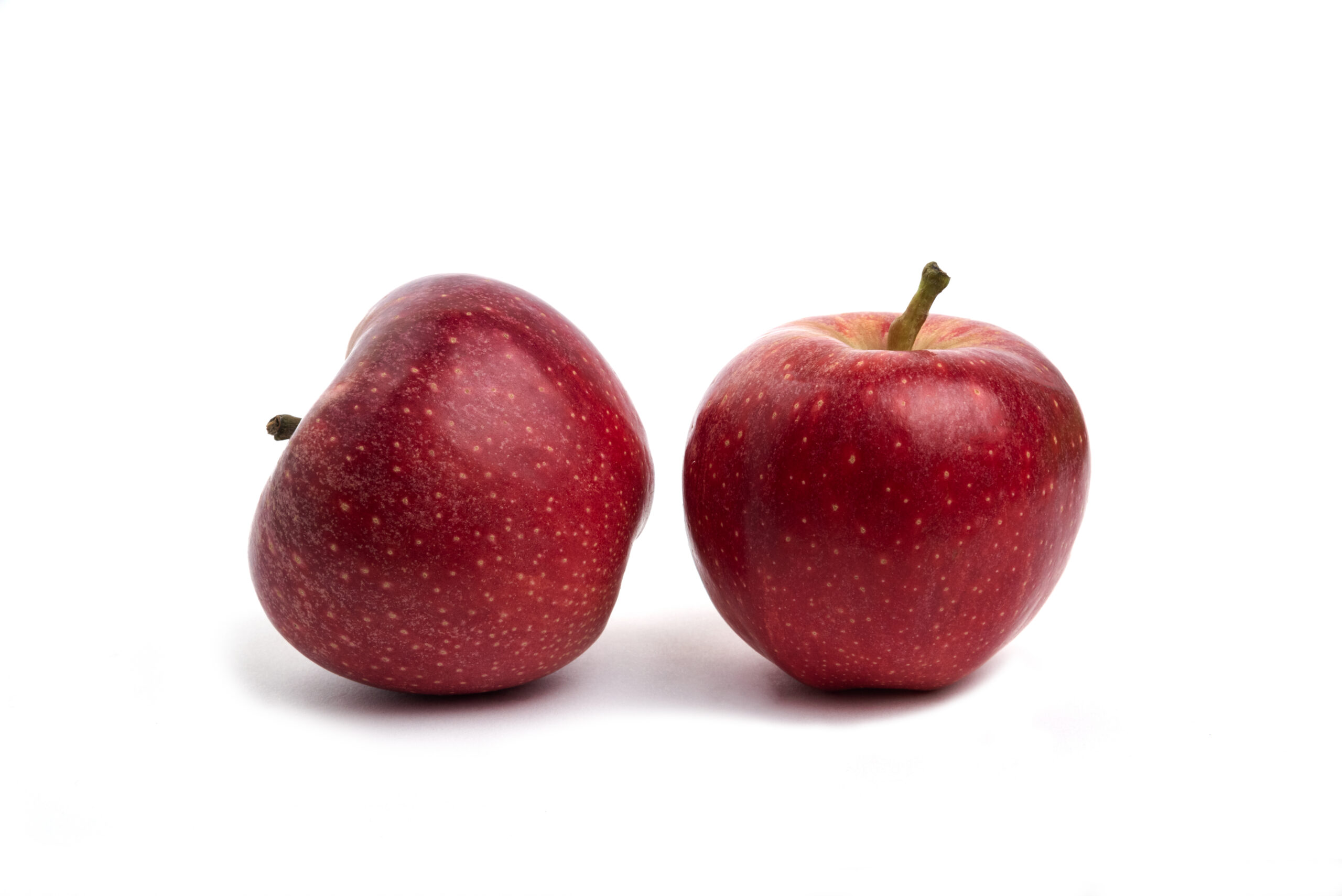 Two red apples isolated on white background